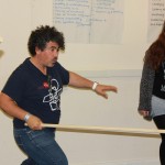 visitors being taught how to fight