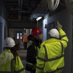 Zach being shown the work taking place in the top three Mellor Building floors