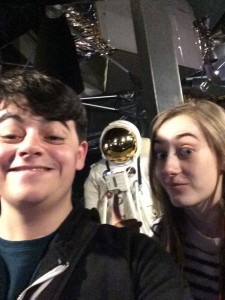 Rebecca with her friend and a spacesuit